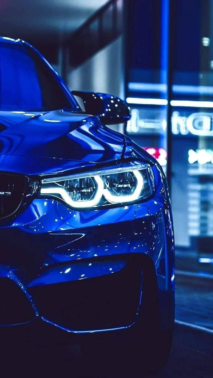 Светящаяся фара синего BMW Обои