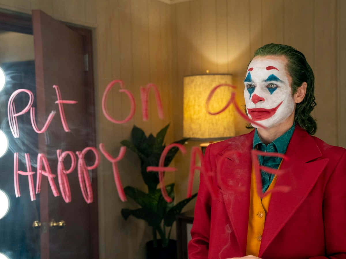 Хоакин Феникс в роли Джокера из DC Обои