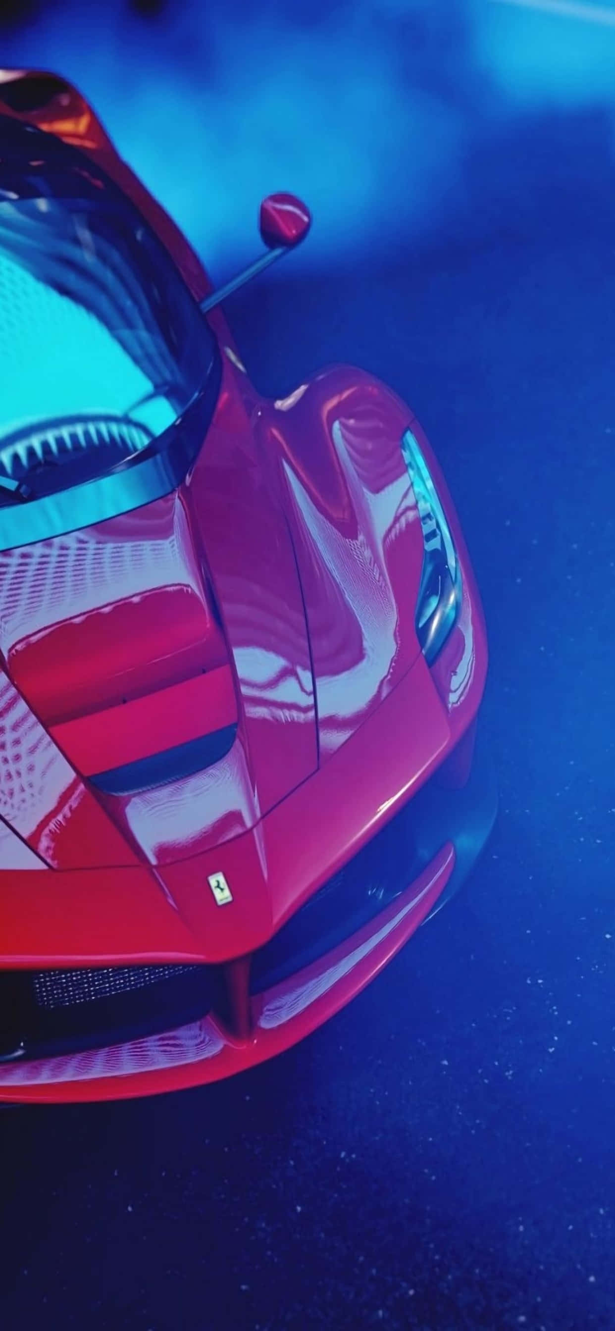 Фон Ferrari для iPhone Xs Max: глянцевый красный Ferrari в синем дыме Обои
