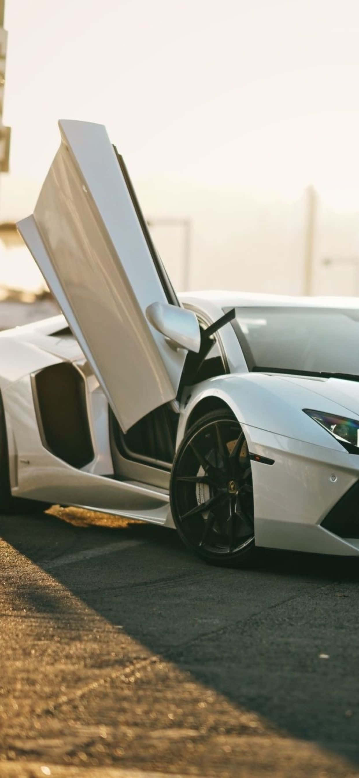 iPhone XS Max на фоне Lamborghini Aventador Roadster Обои