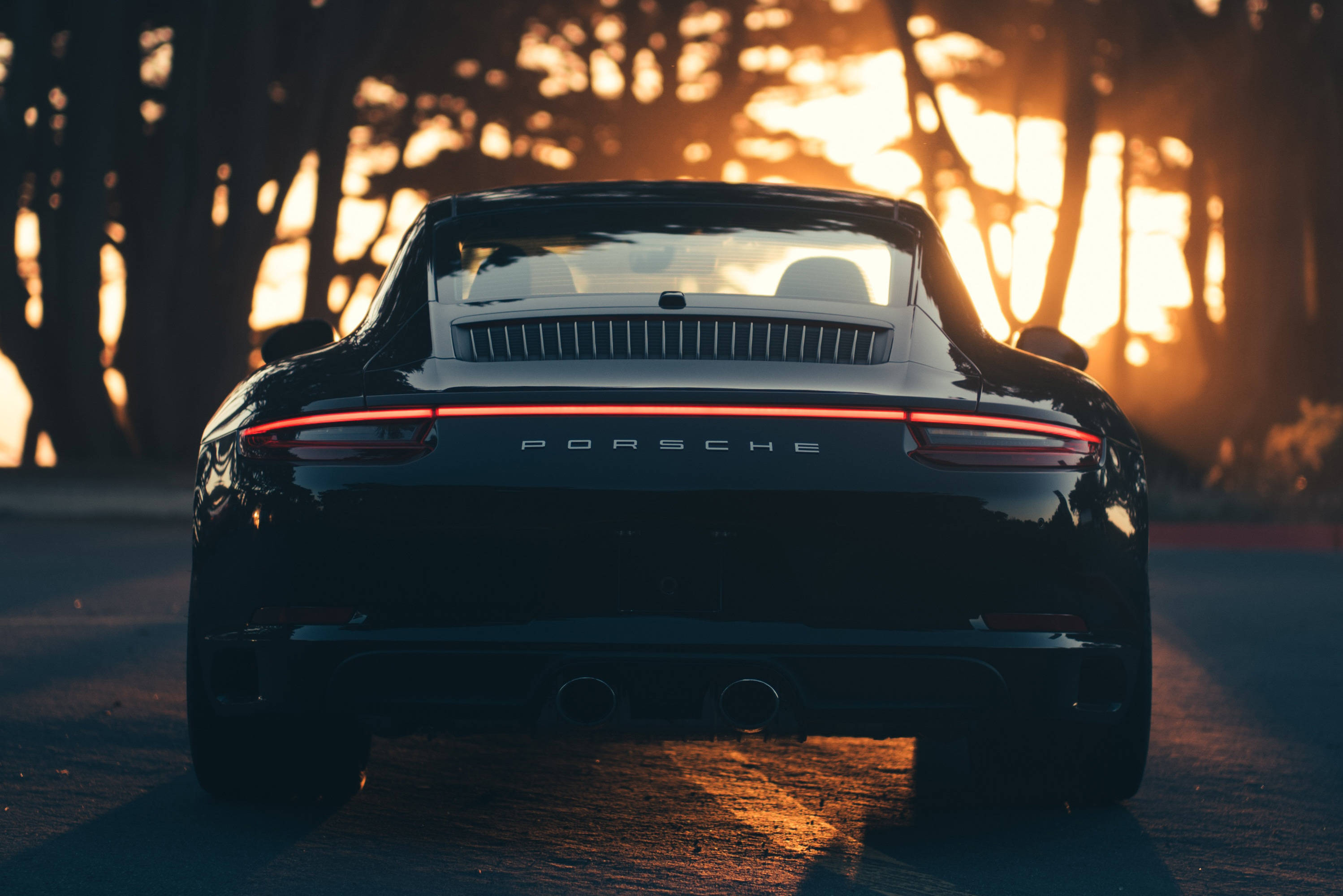 Черный Porsche 911 на закате Обои