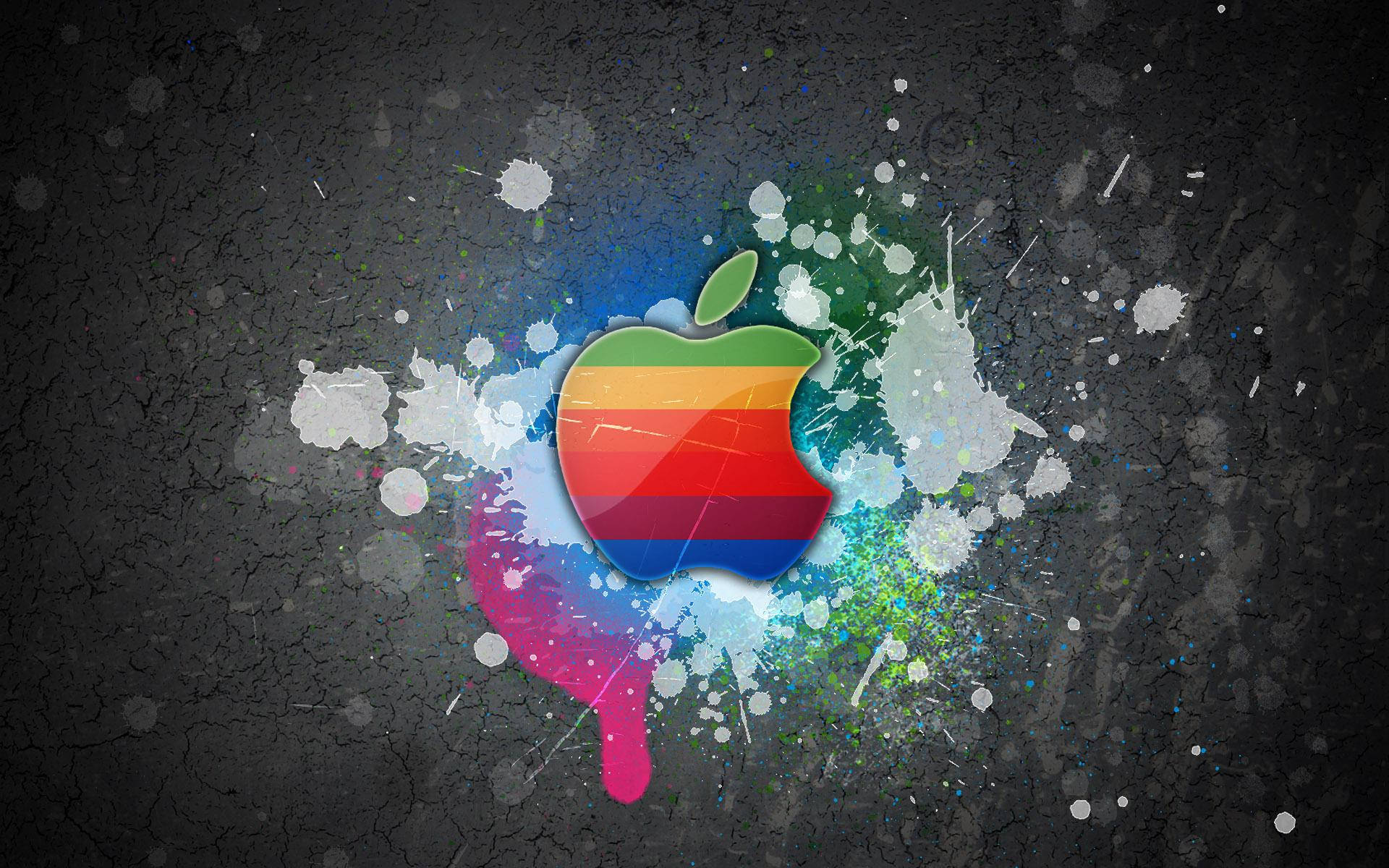Крутые красочные обои с логотипом Apple MacBook на серой стене с разбрызганной краской