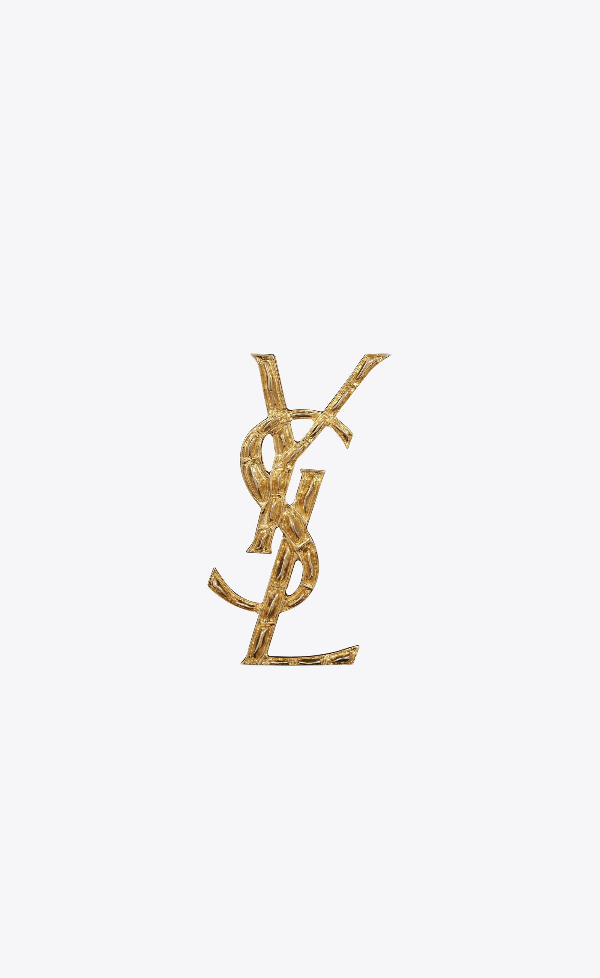Золотая брошь YSL с крокодиловой текстурой Обои