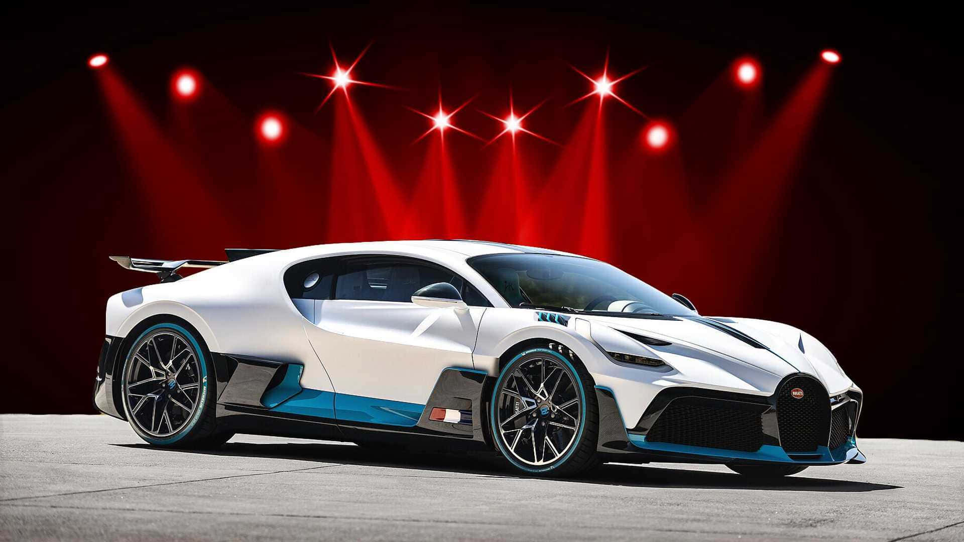 Спортивный красный автомобиль на закате Обои