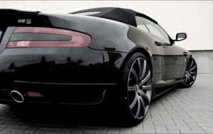 Потрясающий серебристый Aston Martin DB9 на дороге — 1280x800 Обои