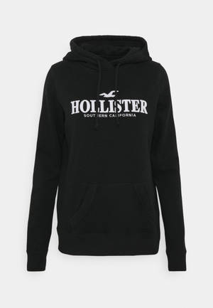 Обои с минималистичной черной худи-курткой Hollister — OnePlus Pad 3 Pro Обои