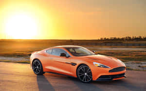 Элегантный Aston Martin Vanquish в движении — MacBook Air M1 Обои